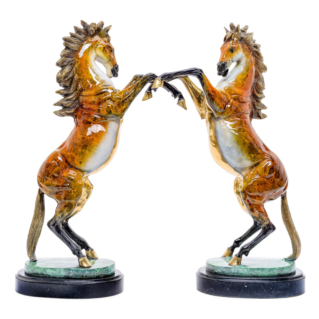 Pair of bronze rearing stallions, showcasing equine strength and beauty on marble bases