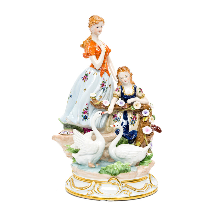 Graceful handmade porcelain sculpture of ladies with swans.