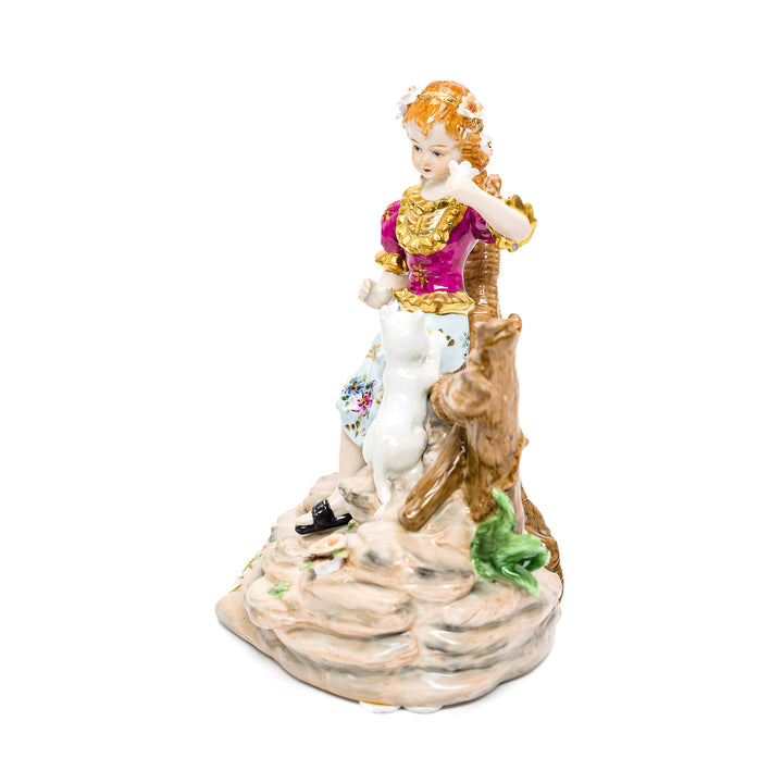 Whimsical porcelain figurine depicting a girl and her cat.