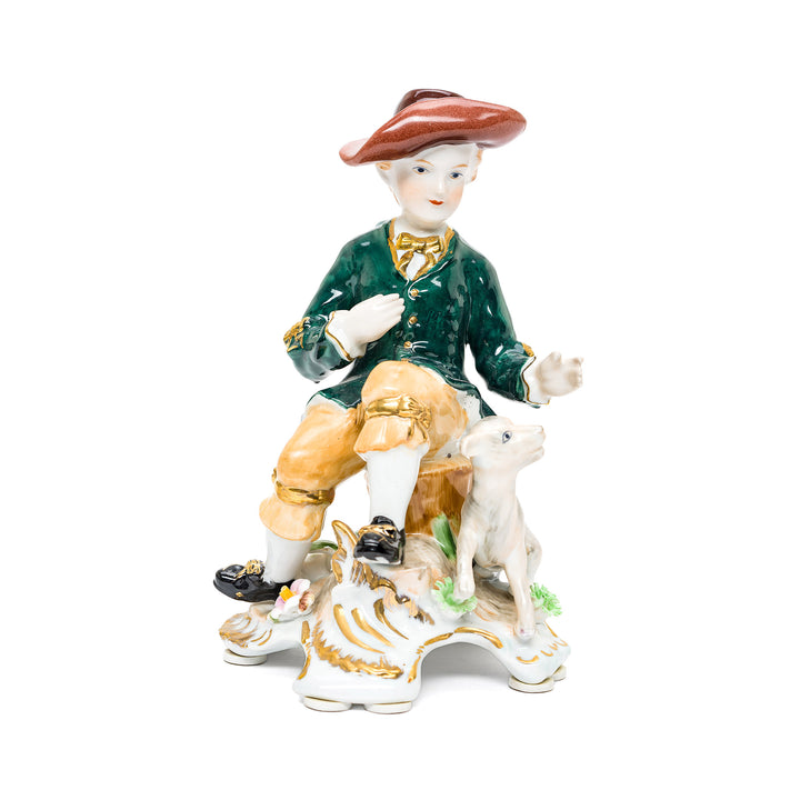 Charming handmade porcelain sculpture of boy with dog.