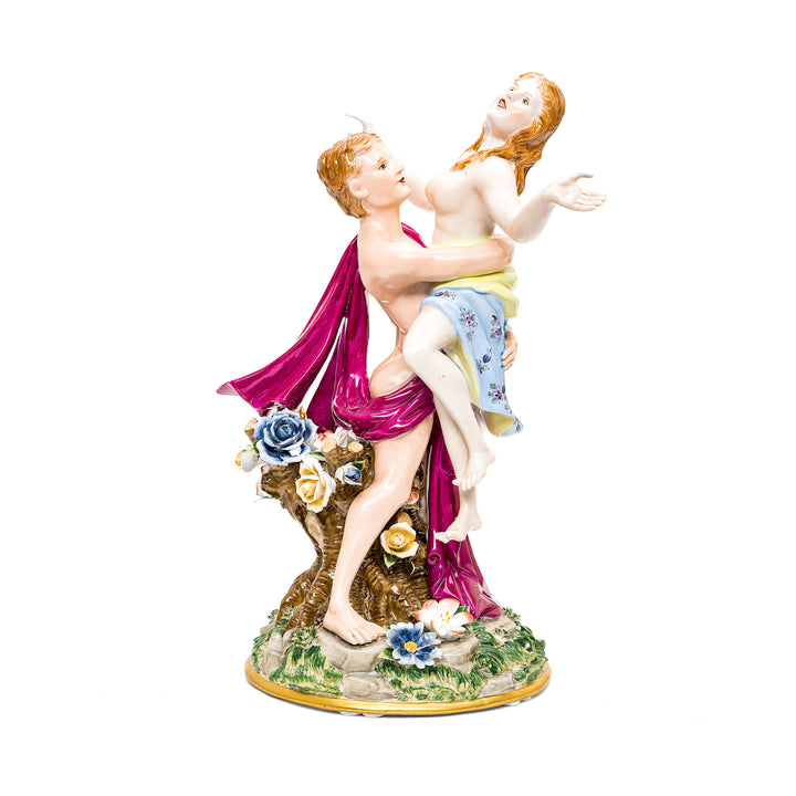 Handmade porcelain sculpture of a romantic couple embracing.