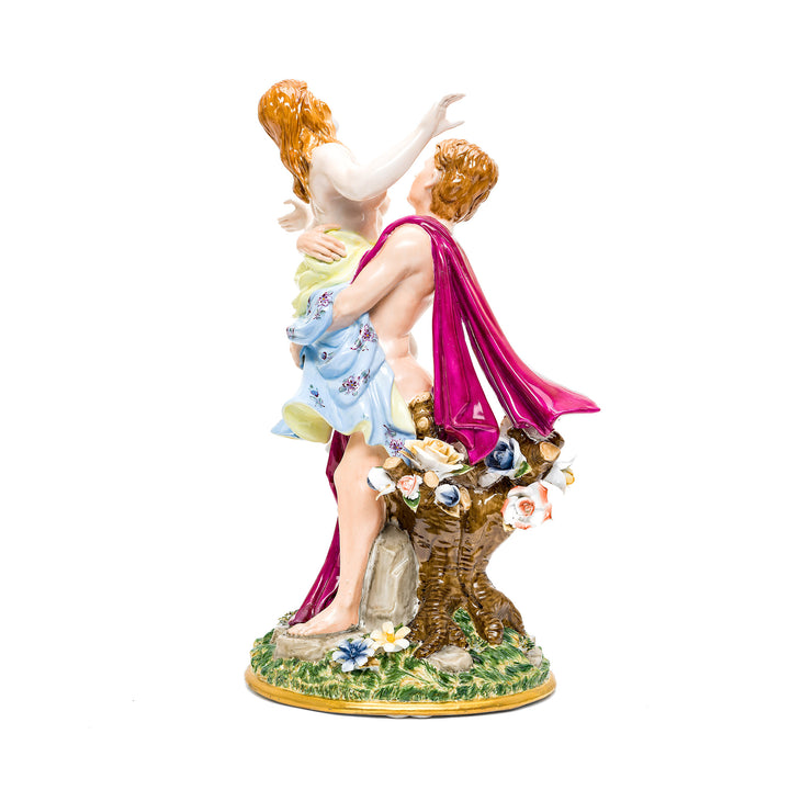 Romantic porcelain decoration featuring a couple in a loving embrace.