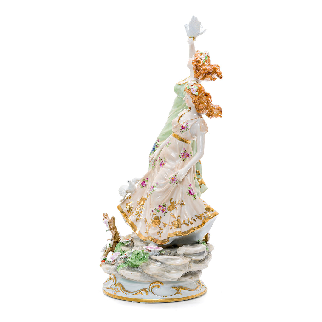 Elegant figurine featuring two females and doves in handcrafted porcelain.
