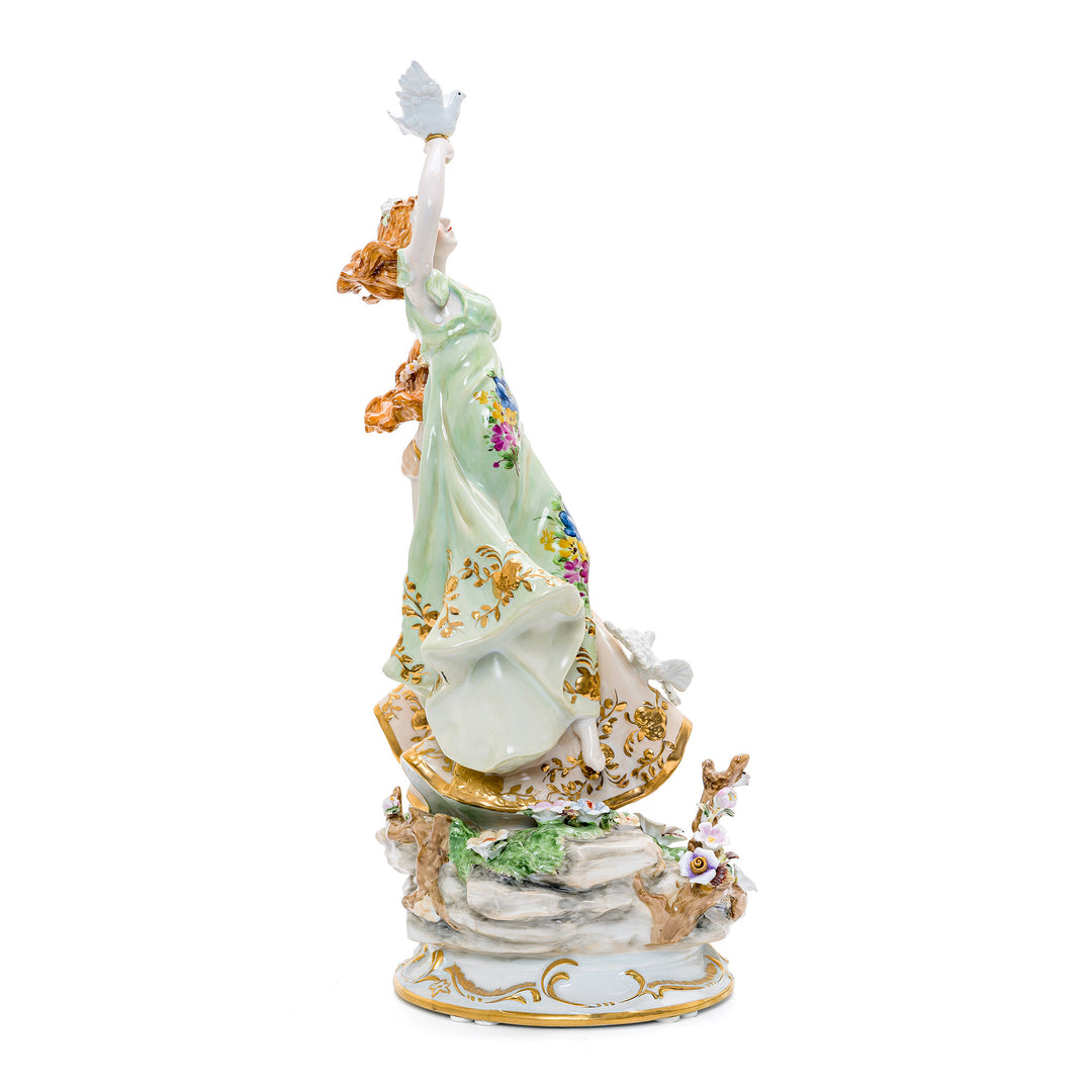 Collectible porcelain art of women and doves symbolizing tranquility.