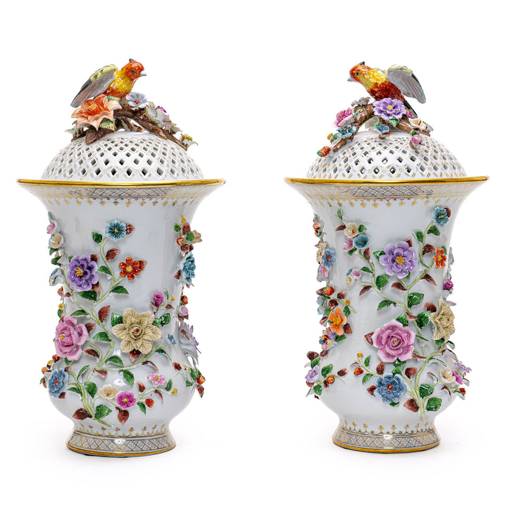 Exquisite pair of porcelain vases with intricate floral designs.