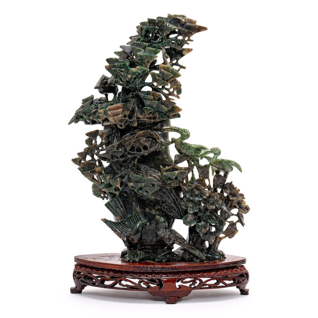 Exquisite Spinach Green Jade Vase illustrating birds amidst pine trees.