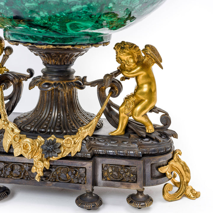 Luxurious two-tone malachite and gilt bowl with cherub figures.