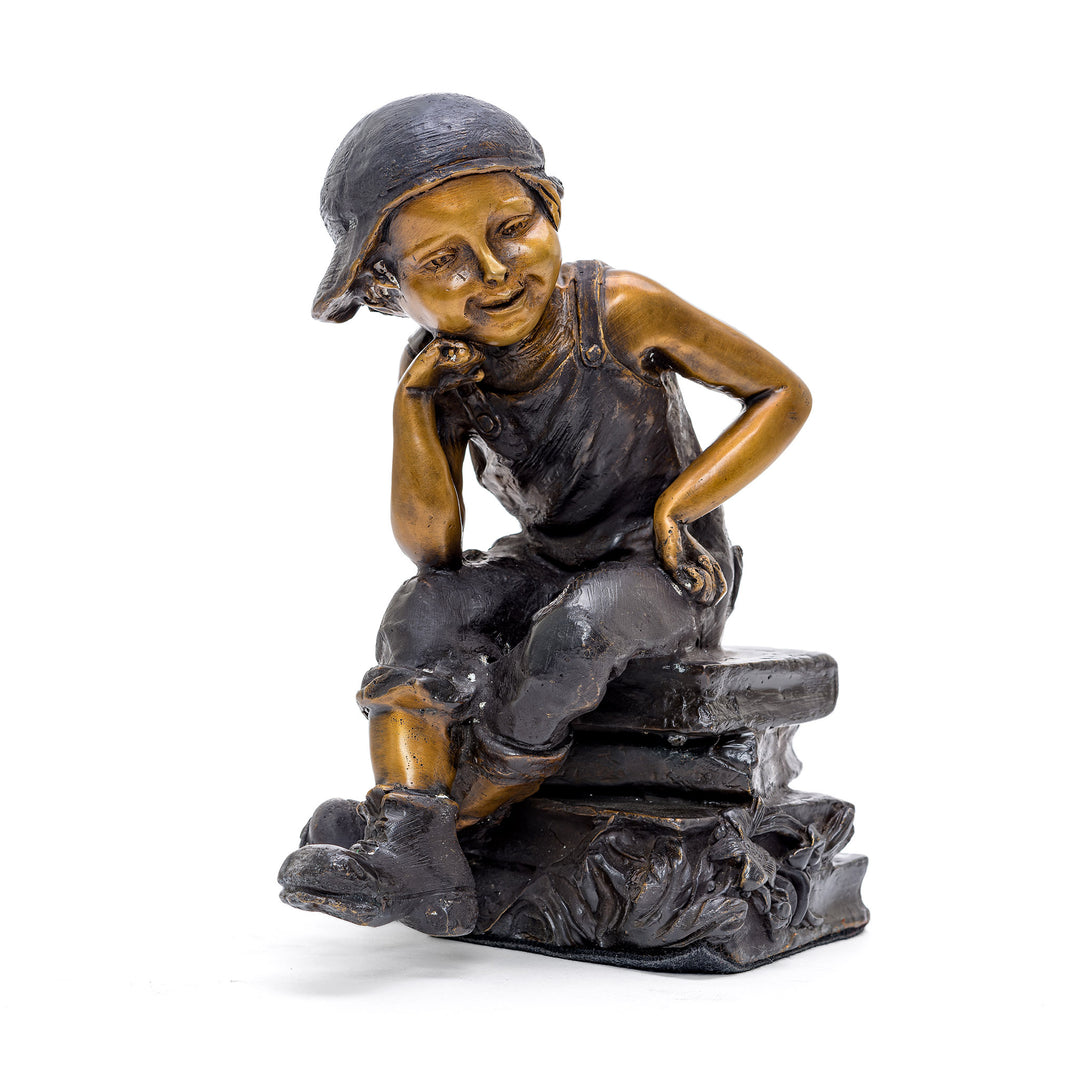 Bronze Sculpture of Boy Seated Thoughtfully on Books.
