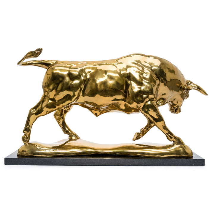 Polished bronze bull statue capturing the essence of strength