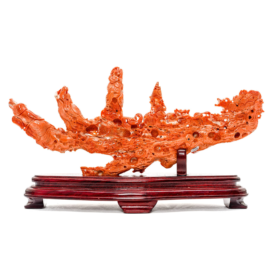 Intricate sculpture of the Seven Immortals in rich coral.