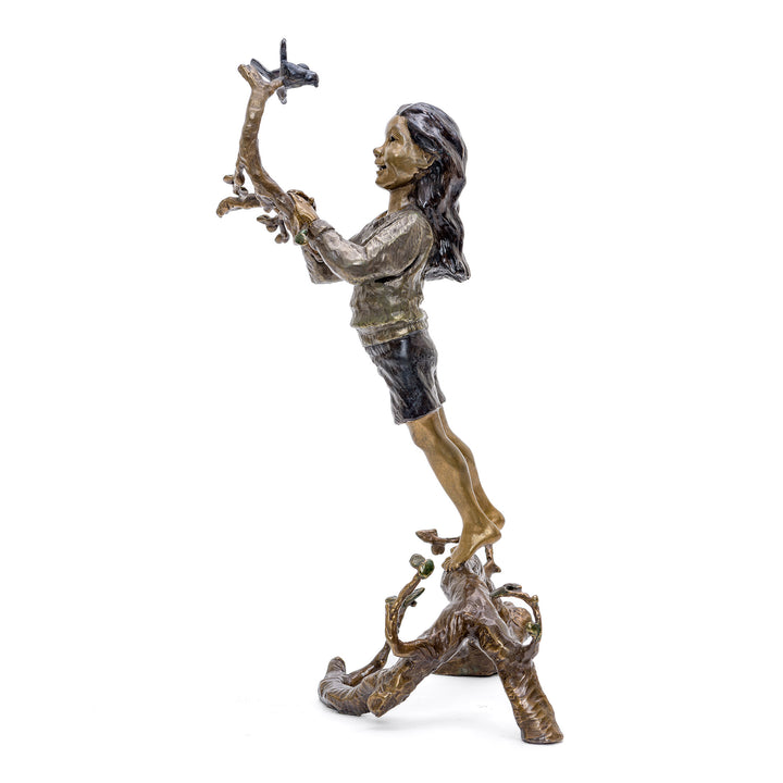 Limited edition whimsical child with bird statue in bronze.