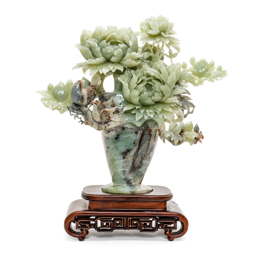 Hand-carved agate sculpture with blooming peonies and perched birds.