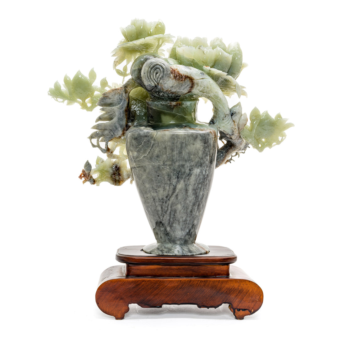 Artisan-crafted agate peony sculpture with bird details.