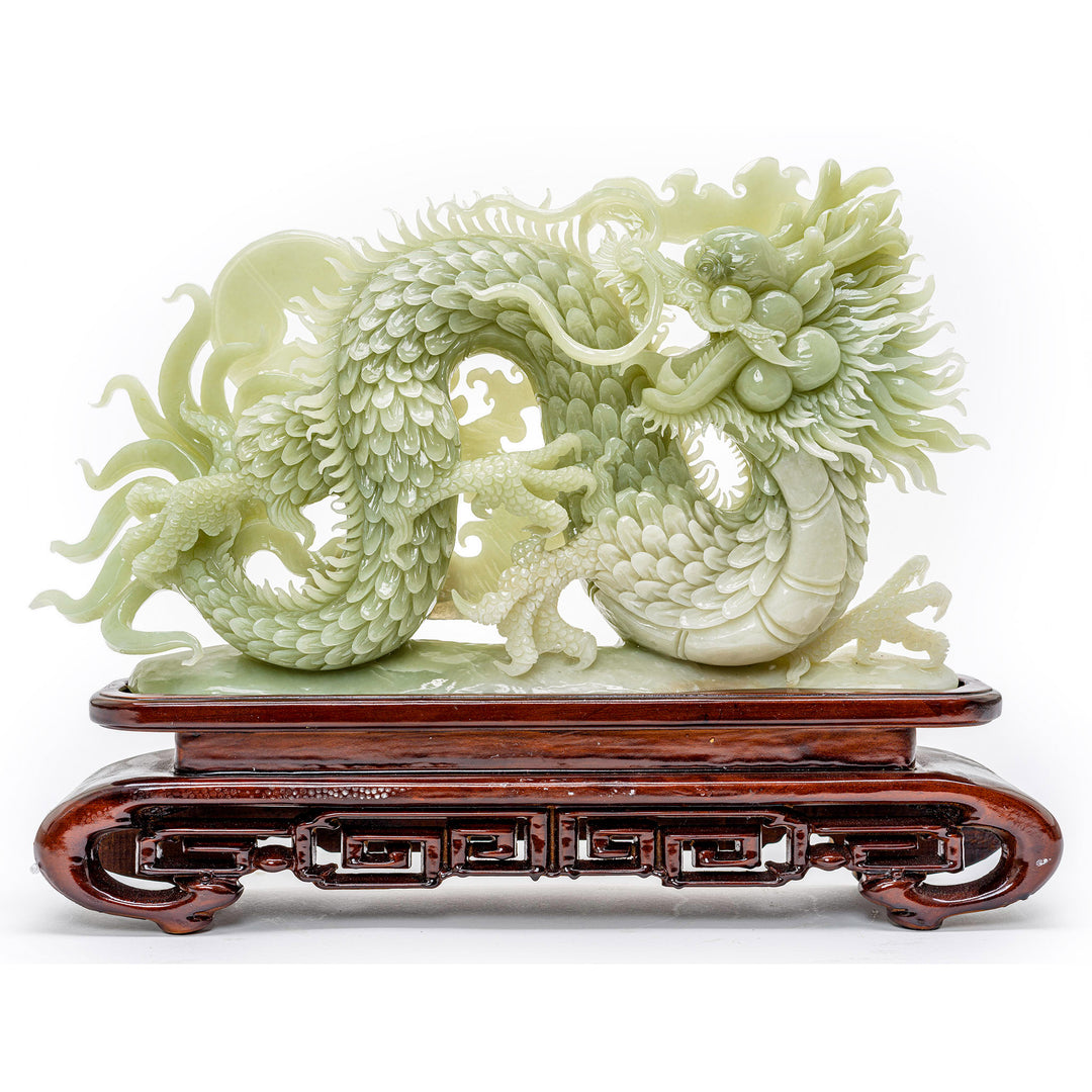 Hand-carved agate dragon sculpture with wooden base.