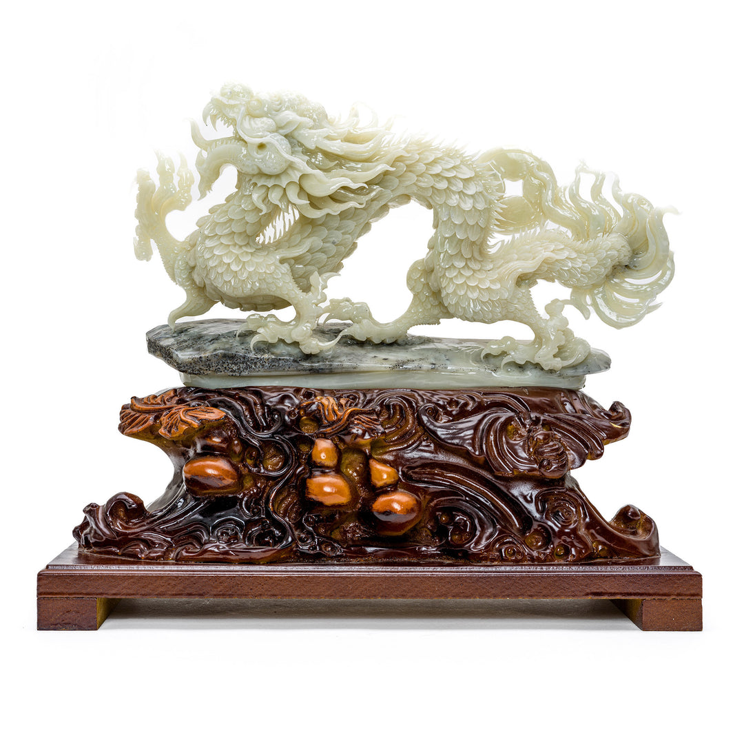 Hand-carved agate marching dragon on a wooden base.