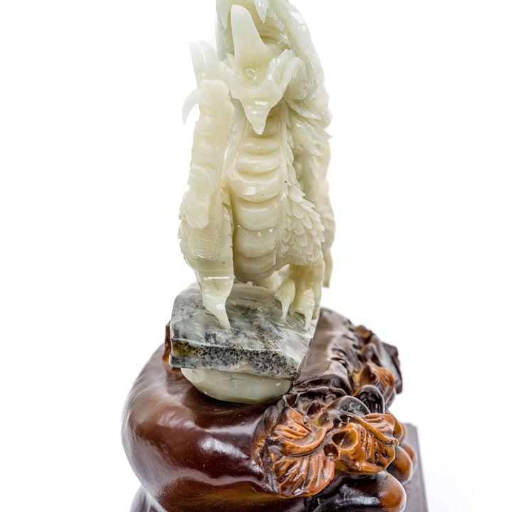 Noble agate dragon carving on an ornate wooden base.