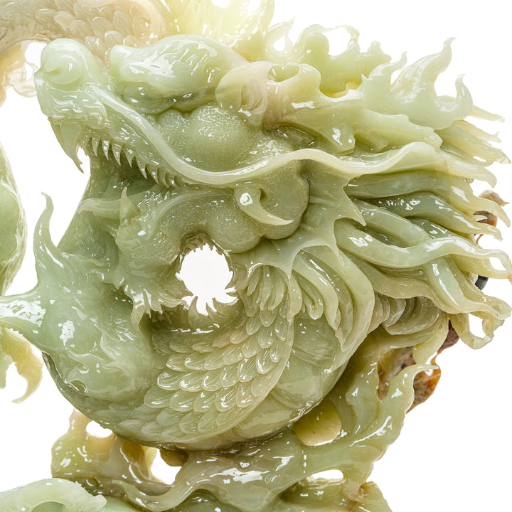 Feng shui compliant agate dragon on traditional carved base.