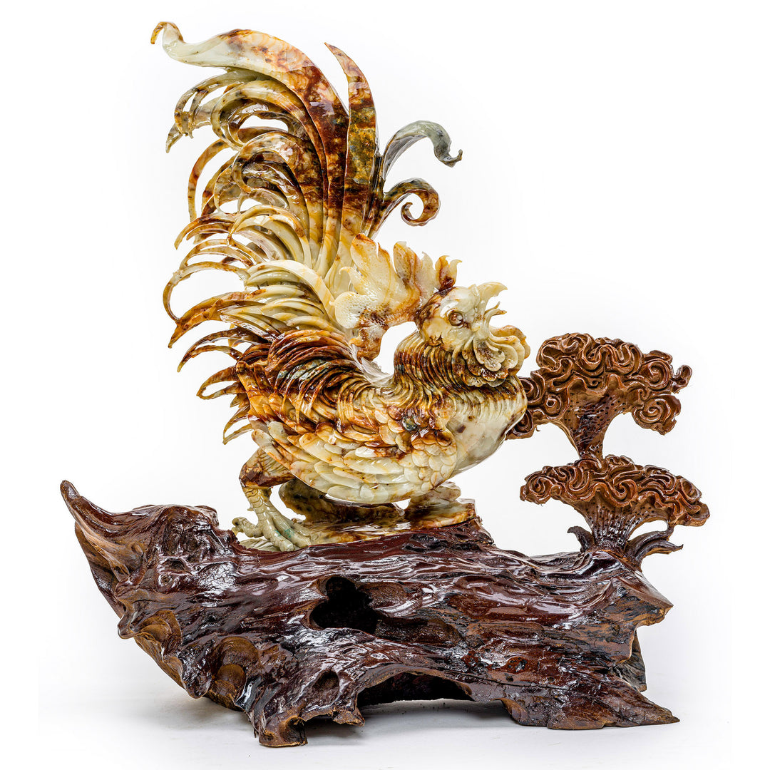 Hand-carved agate rooster sculpture on a wooden branch.