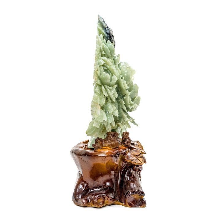 Intricate jade peony and bird piece on wooden stand