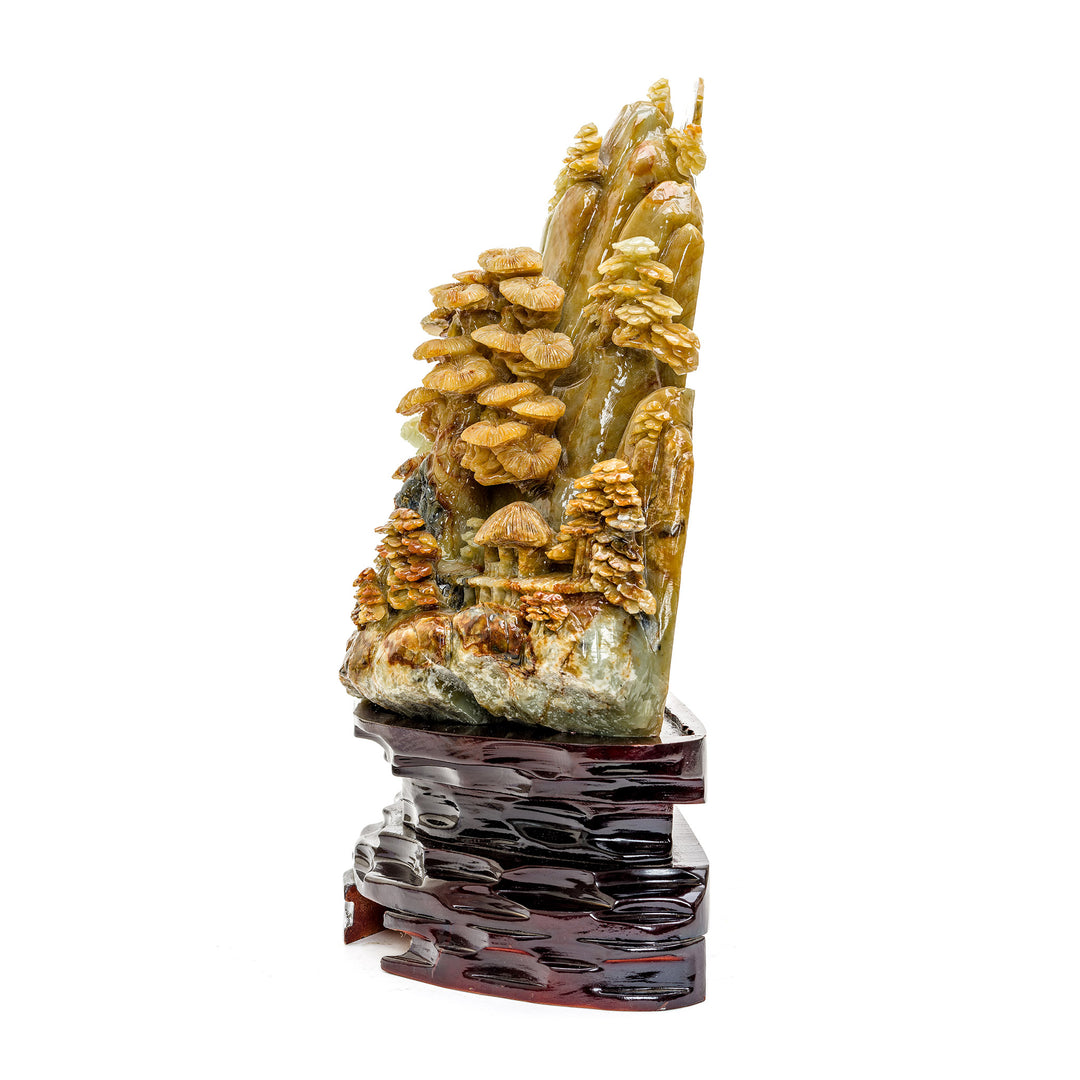 Agate stone carving of a rustic mountain scene
