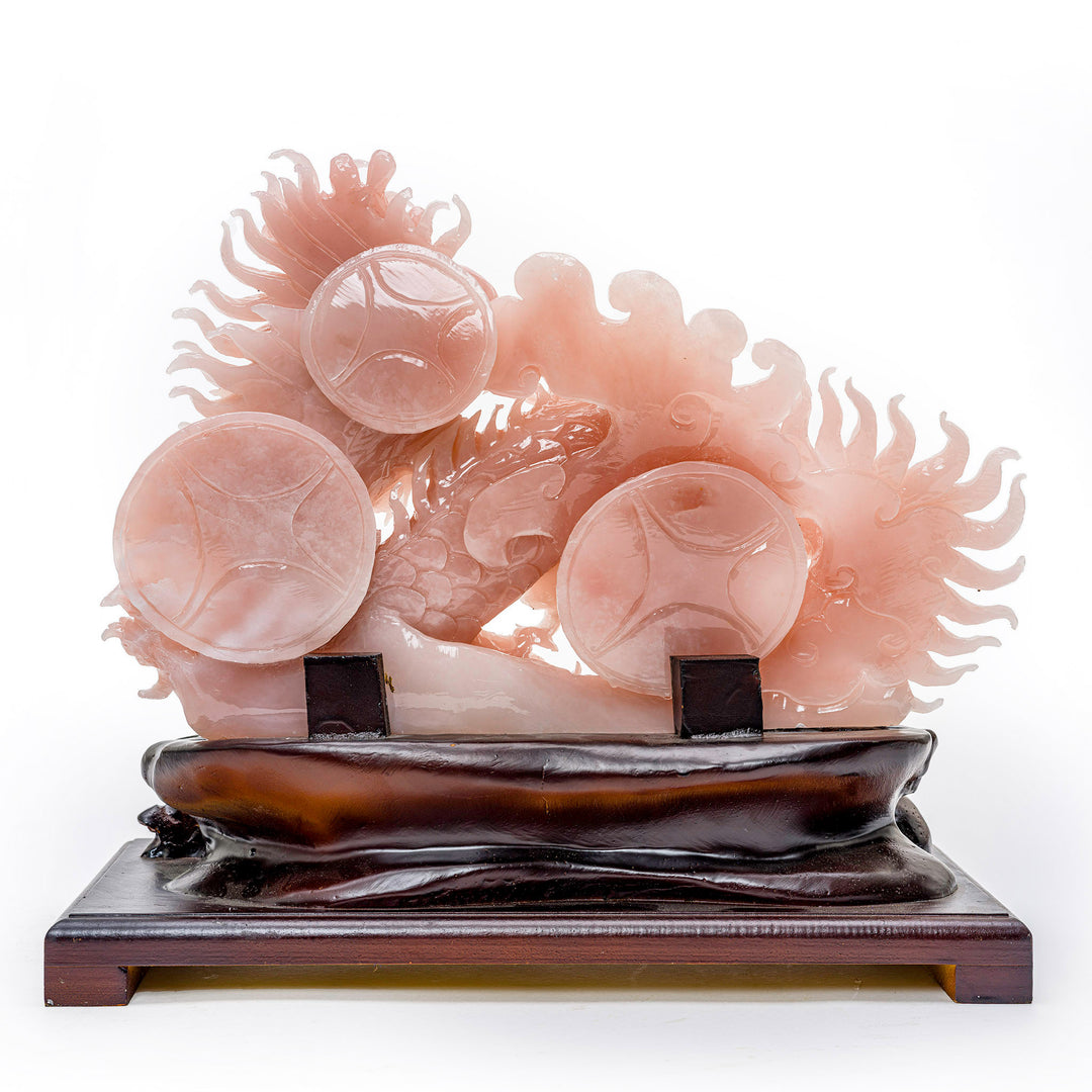 Intricate rose quartz dragon carving, a fusion of art and magic.