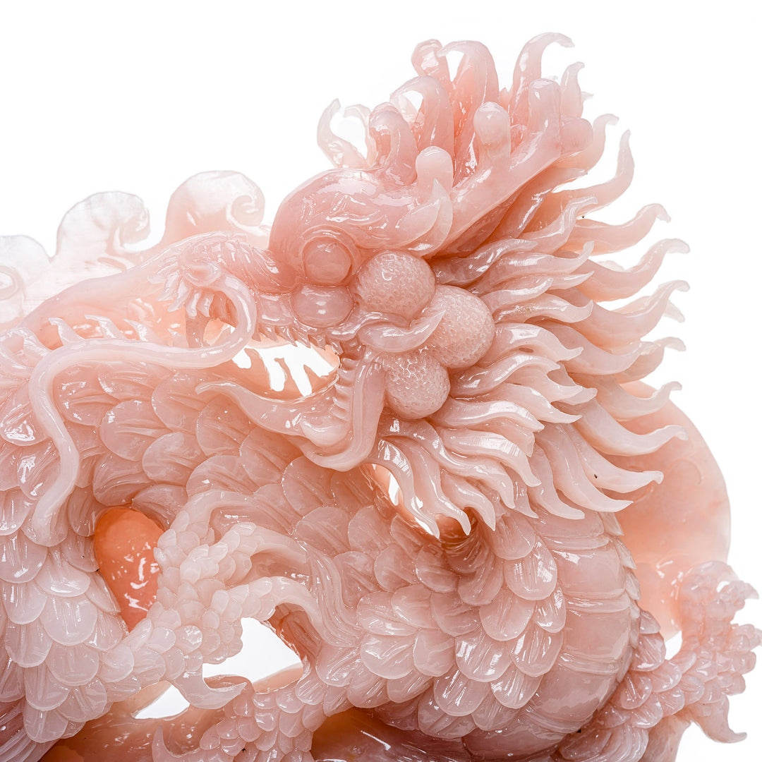 Rose quartz dragon sculpture, a statement of elegance and wisdom.