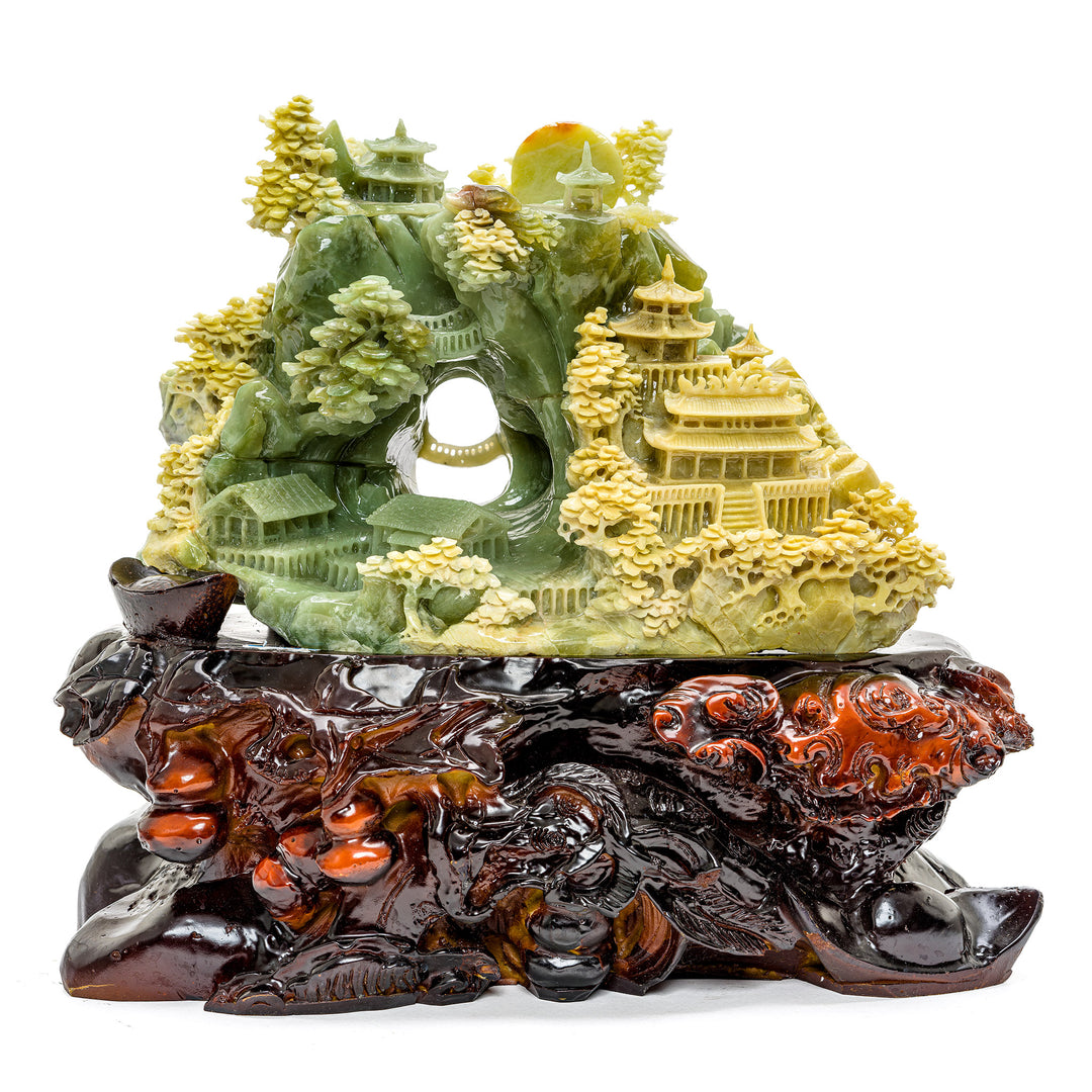 Intricately carved agate village with pagodas and trees
