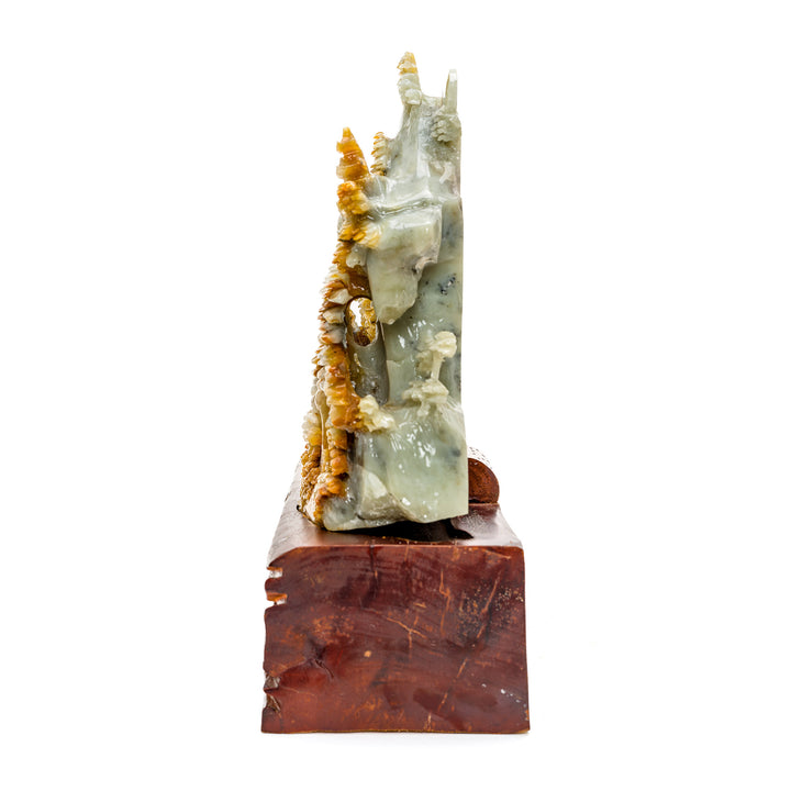 Agate stone sculpture of a tranquil mountainside village