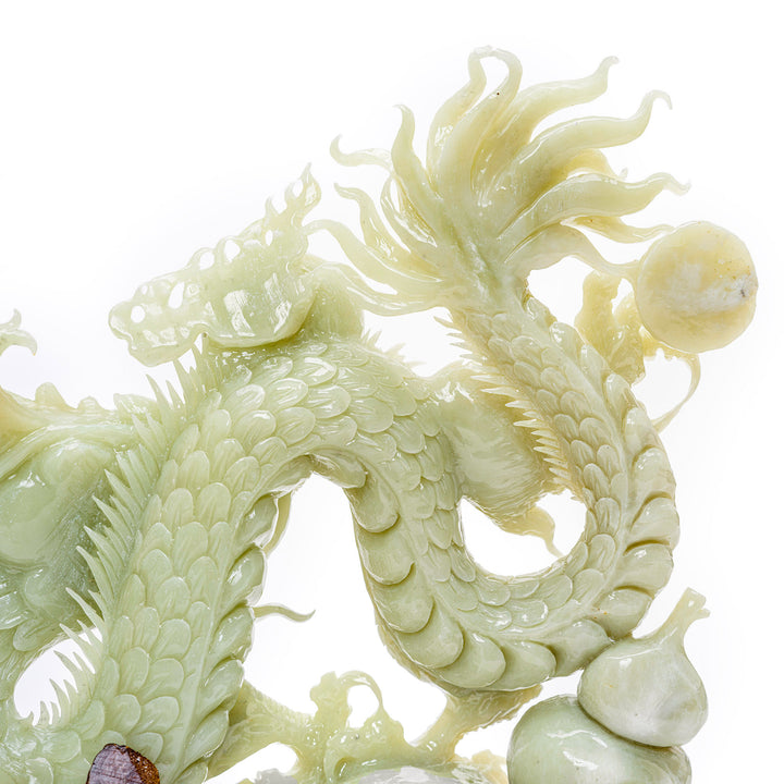 Intricately carved agate dragon seeking the Pearl of Wisdom, a symbolic artwork.