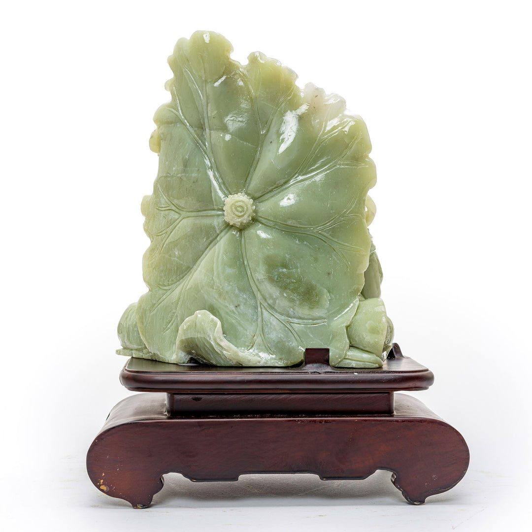 Artistic agate Buddha with lotus, a spiritual symbol of purity and protection.
