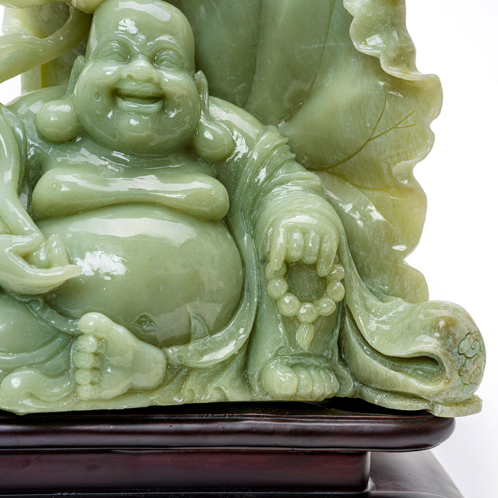 Exquisite agate sculpture of Buddha in tranquil meditation with a lotus.