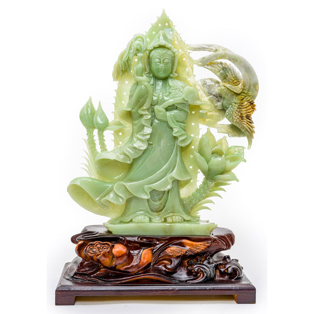 Hand-carved agate sculpture of Kwan Yin with a willow branch and scepter on a wood base.