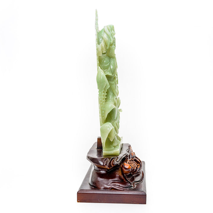 Divine agate sculpture of Kwan Yin holding sacred willow and scepter, a beacon of mercy.