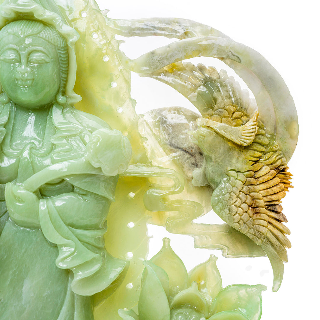 Carved Kwan Yin in agate, an embodiment of divine compassion and purity.