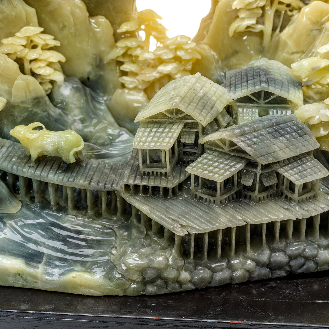 Artisan village scene carved into natural agate stone