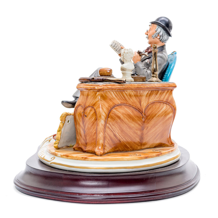 Intricately crafted antique shop scene in porcelain.