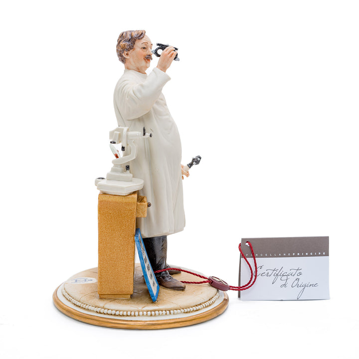 Porcelain sculpture of an eye doctor by Capodimonte.