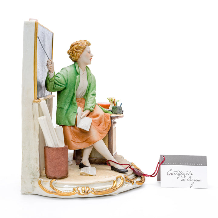 Porcelain sculpture of a teacher at the blackboard by Capodimonte.