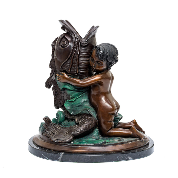 Handcrafted bronze boy holding fish sculpture