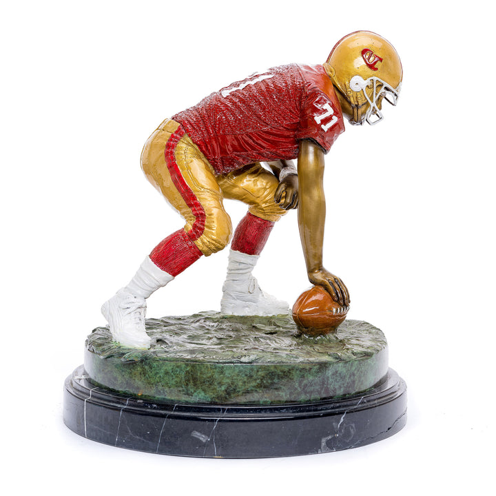 Custom 49er patina on dynamic football player figurine.