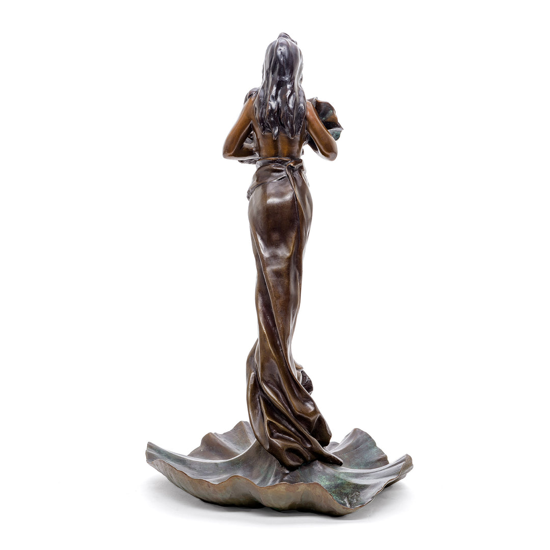 Elegant bronze figurine, a peaceful woman standing on a large lotus base