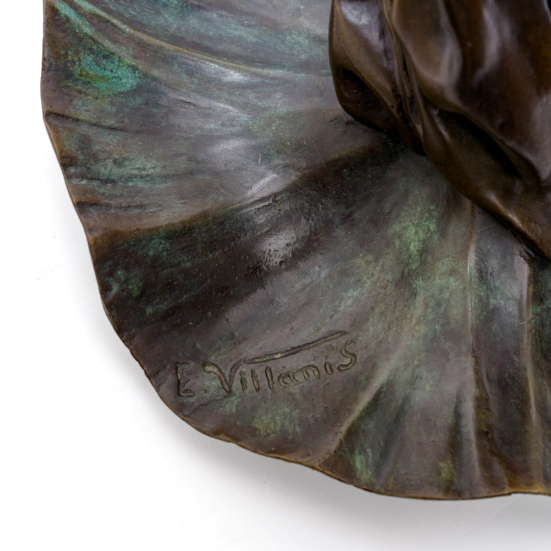Bronze sculpture capturing the tranquil beauty of a woman and lotus blooms