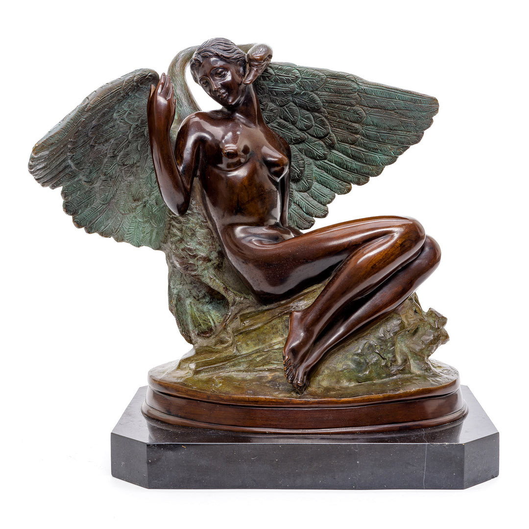 Bronze sculpture of a nude woman with a majestic open-winged swan