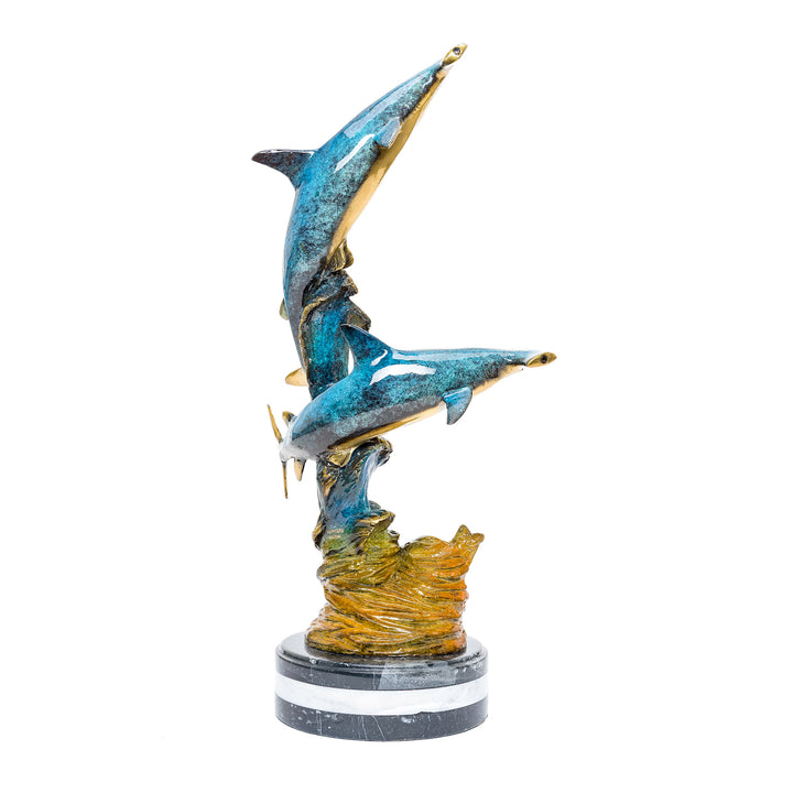 Hammerhead sharks captured in fluid motion, a bronze art piece titled Hunter