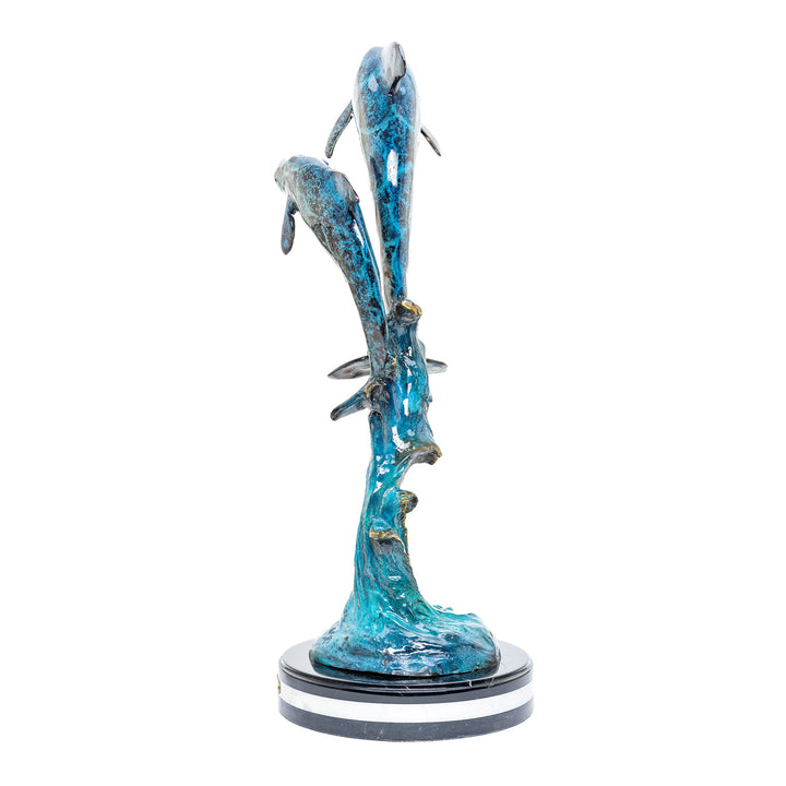 Playful double dolphin bronze art with a vibrant custom patina finish