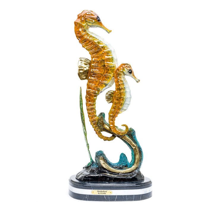 Bronze sculpture of seahorses showcasing marine motherhood.