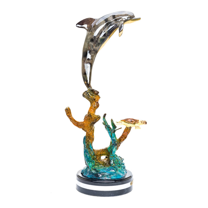 Dolphin and turtle companions in bronze artwork.