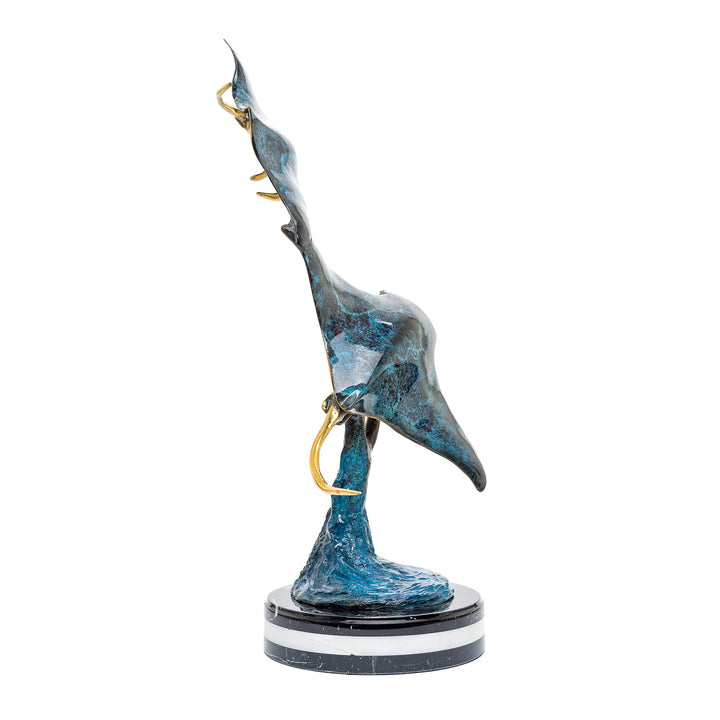 Sculpted bronze art piece capturing the majestic glide of a manta ray.