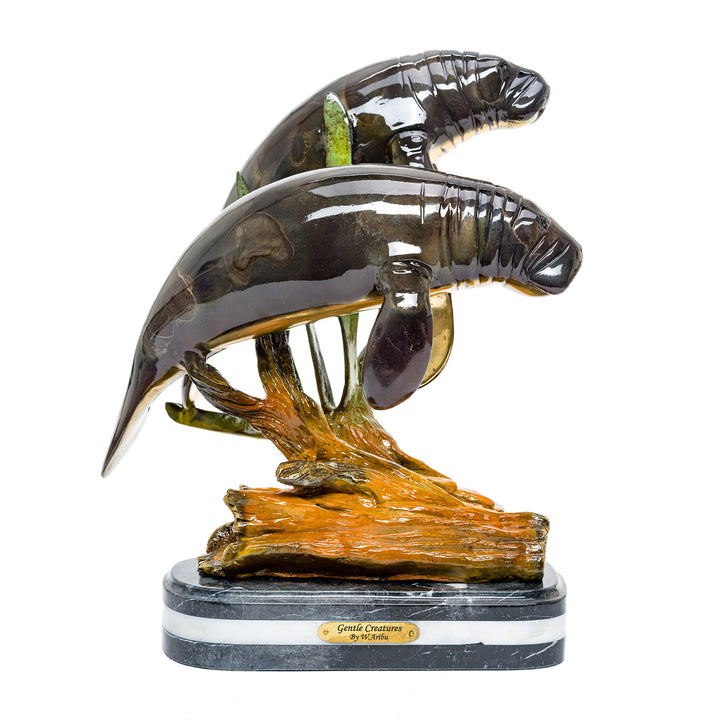 All-bronze double manatee sculpture with lifelike detail.