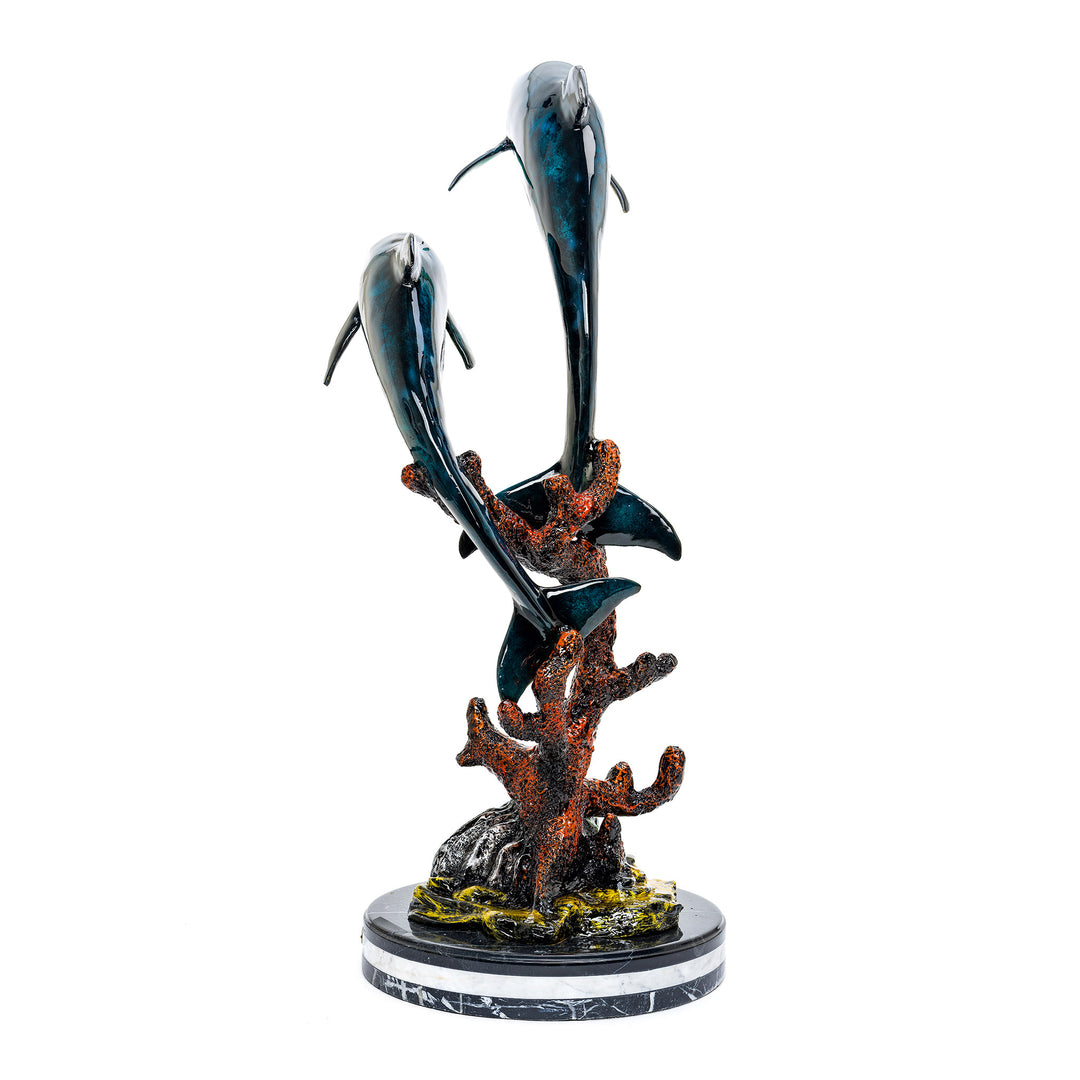 Dynamic bronze dolphins on polished marble base